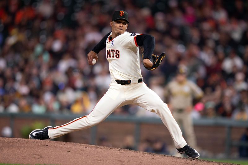 Jun 2, 2025; San Francisco, California, USA; San Francisco Giants pitcher Randy Rodríguez (73) delivers a pitch against the San Diego Padres during the ninth inning at Oracle Park. Mandatory Credit: D. Ross Cameron-Imagn Images