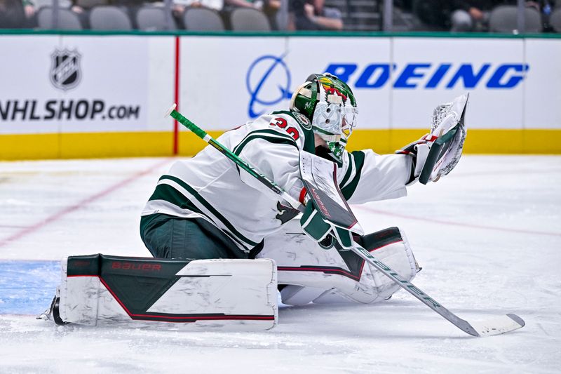 Sep 29, 2022; Dallas, Texas, USA; Minnesota Wild goaltender Jesper Wallstedt (30) makes a save on a Dallas Stars shot during the second period at the American Airlines Center. Mandatory Credit: Jerome Miron-USA TODAY Sports