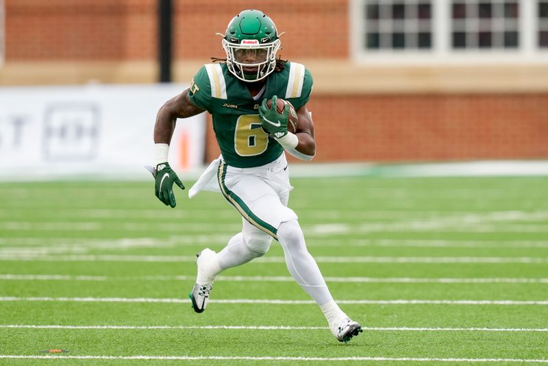 Sep 10, 2022; Charlotte, North Carolina, USA; Charlotte 49ers running back ChaVon McEachern (6) runs around end for yardage against the Maryland Terrapins during the first quarter at Jerry Richardson Stadium. Mandatory Credit: Jim Dedmon-USA TODAY Sports