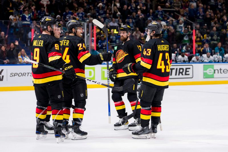 Dec 23, 2023; Vancouver, British Columbia, CAN; Vancouver Canucks forward J.T. Miller (9) and forward Pius Suter (24) abd forward Brock Boeser (6) and defenseman Filip Hronek (17) and defenseman Quinn Hughes (43) celebrate Suter   s goal against the San Jose Sharks in the third period at Rogers Arena. Canucks won 7-4. Mandatory Credit: Bob Frid-USA TODAY Sports