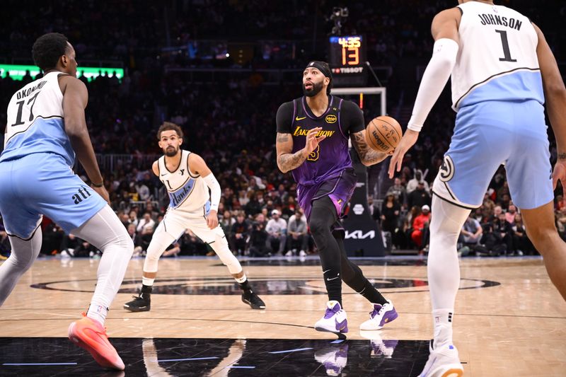 ATLANTA, GA - DECEMBER 6: Anthony Davis #3 of the Los Angeles Lakers handles the ball during the game against the Atlanta Hawks on December 6, 2024 at State Farm Arena in Atlanta, Georgia.  NOTE TO USER: User expressly acknowledges and agrees that, by downloading and/or using this Photograph, user is consenting to the terms and conditions of the Getty Images License Agreement. Mandatory Copyright Notice: Copyright 2024 NBAE (Photo by Adam Hagy/NBAE via Getty Images)