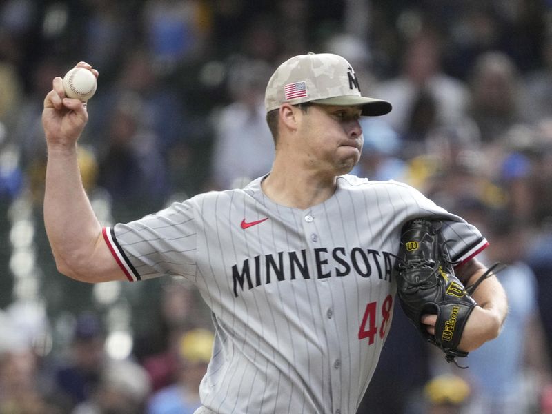 May 18, 2025; Milwaukee, Wisconsin, USA; Minnesota Twins pitcher Justin Topa (48) delivers a pitch against the Milwaukee Brewers in the seventh inning at American Family Field. Mandatory Credit: Michael McLoone-Imagn Images