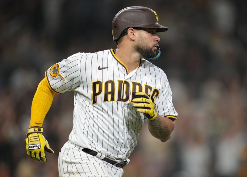 Jul 25, 2023; San Diego, California, USA; San Diego Padres catcher Gary Sanchez (99) hits a two run home run during the seventh inning against the Pittsburgh Pirates at Petco Park. Mandatory Credit: Ray Acevedo-USA TODAY Sports