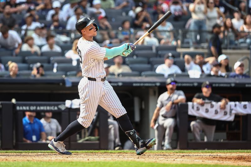 Aug 25, 2024; Bronx, New York, USA;  New York Yankees center fielder Aaron Judge (99) hits a solo home run in the seventh inning against the Colorado Rockies at Yankee Stadium. Mandatory Credit: Wendell Cruz-USA TODAY Sports