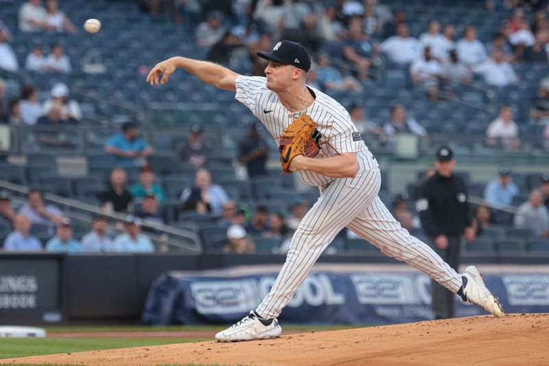 May 21, 2024; Bronx, New York, USA; New York Yankees starting pitcher Clarke Schmidt (36) delivers a pitch during the first inning against the Seattle Mariners at Yankee Stadium. Mandatory Credit: Vincent Carchietta-USA TODAY Sports