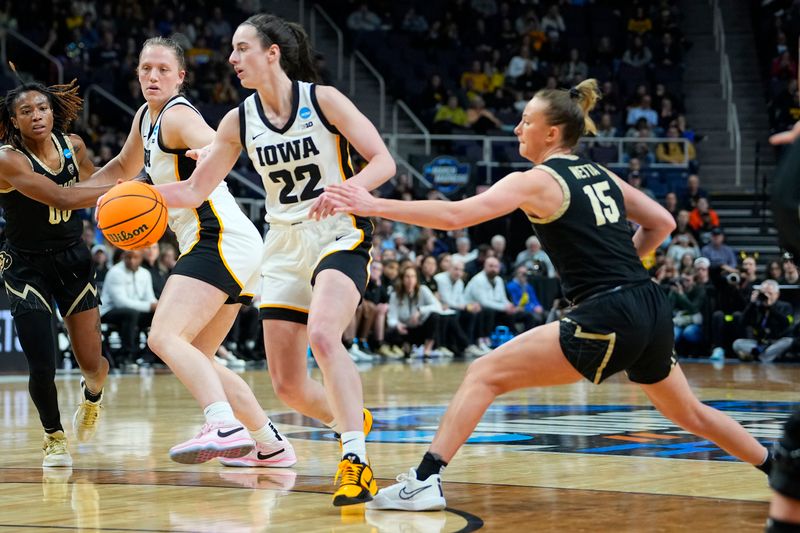 Mar 30, 2024; Albany, NY, USA; Iowa Hawkeyes guard Caitlin Clark (22) dribbles the ball against Colorado Buffaloes guard Kindyll Wetta (15) in the semifinals of the Albany Regional of the 2024 NCAA Tournament at the MVP Arena. Mandatory Credit: Gregory Fisher-USA TODAY Sports