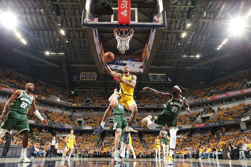 INDIANAPOLIS, IN - APRIL 26: Obi Toppin #1 of the Indiana Pacers drives to the basket during the game against the Milwaukee Bucks during Round 1 Game 3 of the 2024 NBA Playoffs on April 26, 2024 at Gainbridge Fieldhouse in Indianapolis, Indiana. NOTE TO USER: User expressly acknowledges and agrees that, by downloading and or using this Photograph, user is consenting to the terms and conditions of the Getty Images License Agreement. Mandatory Copyright Notice: Copyright 2023 NBAE (Photo by Nathaniel S. Butler/NBAE via Getty Images)