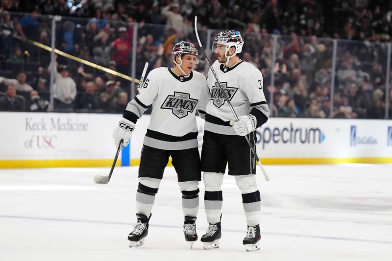 Apr 13, 2024; Los Angeles, California, USA; LA Kings defenseman Matt Roy (3) celebrates with center Blake Lizotte (46) after scoring a goal against the Anaheim Ducks in the second period at Crypto.com Arena. Mandatory Credit: Kirby Lee-USA TODAY Sports