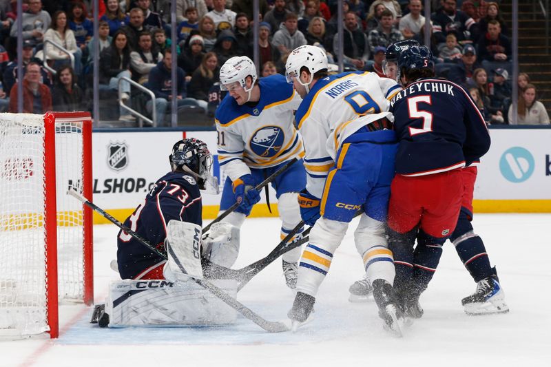 Jan 3, 2026; Columbus, Ohio, USA; Buffalo Sabres right wing  Josh Doan (91) shoots over the pad of Columbus Blue Jackets goalie Jet Greaves (73) for a goal during the first period at Nationwide Arena. Mandatory Credit: Russell LaBounty-Imagn Images