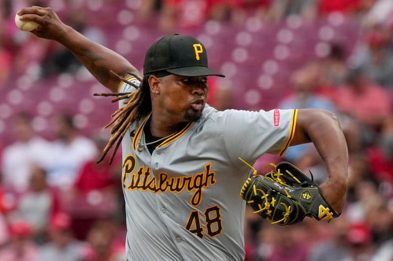 Jun 26, 2024; Cincinnati, Ohio, USA; Pittsburgh Pirates pitcher Luis L. Ortiz (48) throws against the Cincinnati Reds in the first inning at Great American Ball Park. Mandatory Credit: Sam Greene/The Cincinnati Enquirer-USA TODAY Sports