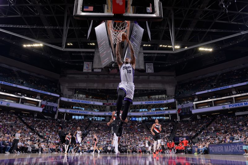 SACRAMENTO, CA - OCTOBER 13: DeMar DeRozan #10 of the Sacramento Kings dunks the ball during the game against the Portland Trail Blazers during a NBA preseason game on October 13, 2024 at Golden 1 Center in Sacramento, California. NOTE TO USER: User expressly acknowledges and agrees that, by downloading and or using this Photograph, user is consenting to the terms and conditions of the Getty Images License Agreement. Mandatory Copyright Notice: Copyright 2024 NBAE (Photo by Rocky Widner/NBAE via Getty Images)