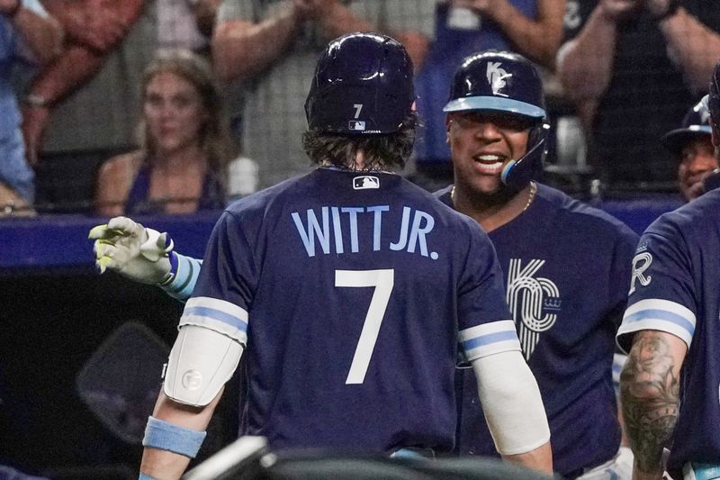 Sep 29, 2023; Kansas City, Missouri, USA; Kansas City Royals shortstop Bobby Witt Jr. (7) celebrates with first baseman Salvador Perez (13) after hitting his 30th home run of his career, a two run home run against the New York Yankees in the seventh inning at Kauffman Stadium. Mandatory Credit: Denny Medley-USA TODAY Sports