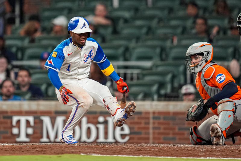 Sep 13, 2025; Cumberland, Georgia, USA; Atlanta Braves second baseman Ozzie Albies (1) reacts after fouling a pitch off his leg against the Houston Astros during the ninth inning at Truist Park. Mandatory Credit: Dale Zanine-Imagn Images