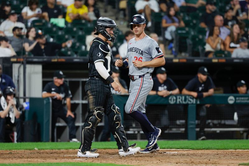 Jul 8, 2024; Chicago, Illinois, USA; Minnesota Twins outfielder Max Kepler (26) scores against the Chicago White Sox during the 11th inning at Guaranteed Rate Field. Mandatory Credit: Kamil Krzaczynski-USA TODAY Sports