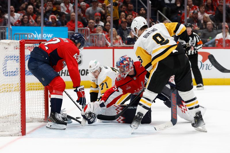 Apr 4, 2024; Washington, District of Columbia, USA; Pittsburgh Penguins center Evgeni Malkin (71) attempts to shoot the puck on Washington Capitals goaltender Charlie Lindgren (79) as Capitals defenseman Martin Fehervary (42) defends in the second period at Capital One Arena. Mandatory Credit: Geoff Burke-USA TODAY Sports