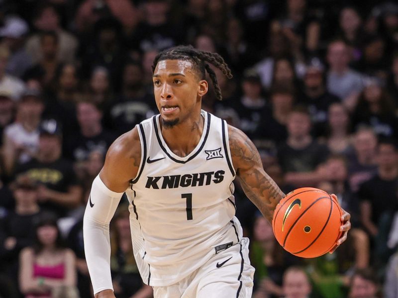 Jan 23, 2024; Orlando, Florida, USA; UCF Knights guard Antwann Jones (1) brings the ball up court during the second half against the West Virginia Mountaineers at Addition Financial Arena. Mandatory Credit: Mike Watters-USA TODAY Sports