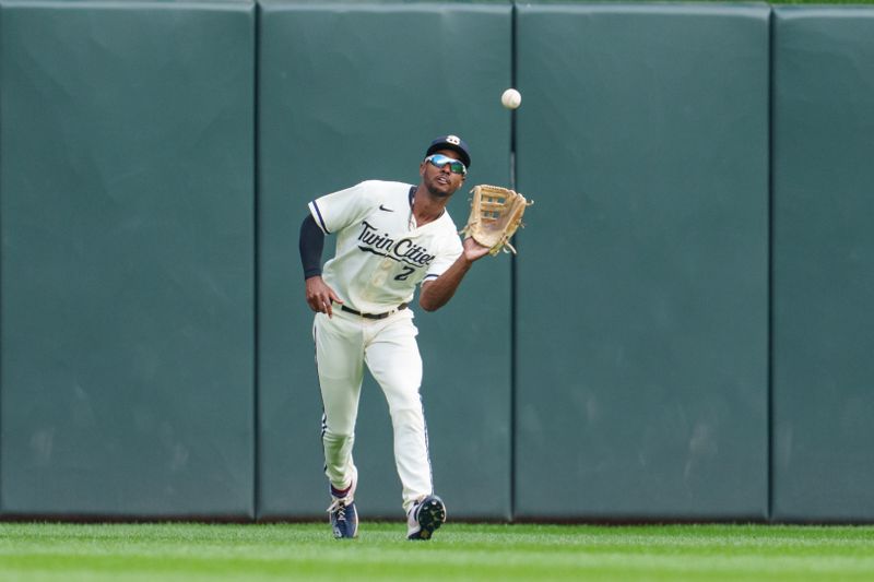 Sep 24, 2023; Minneapolis, Minnesota, USA; Minnesota Twins center fielder Michael A. Taylor (2) catches a fly ball to retire Los Angeles Angels left fielder Randal Grichuk (15) in the first inning at Target Field. Mandatory Credit: Matt Blewett-USA TODAY Sports