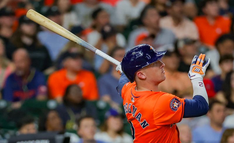 Jul 12, 2024; Houston, Texas, USA; Houston Astros third baseman Alex Bregman (2) hits a home run against the Texas Rangers in the fifth inning at Minute Maid Park. Mandatory Credit: Thomas Shea-USA TODAY Sports