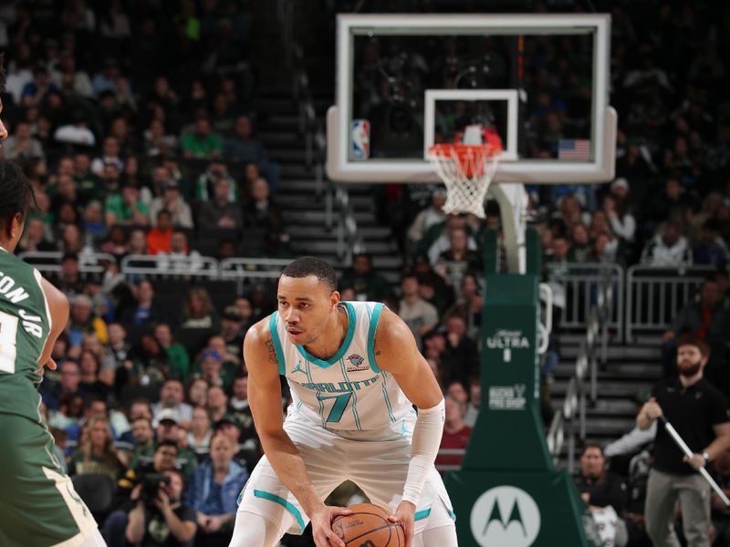 MILWAUKEE, WI - FEBRUARY 9: Bryce McGowans #7 of the Charlotte Hornets handles the ball during the game against the Milwaukee Bucks on February 9, 2024 at the Fiserv Forum Center in Milwaukee, Wisconsin. NOTE TO USER: User expressly acknowledges and agrees that, by downloading and or using this Photograph, user is consenting to the terms and conditions of the Getty Images License Agreement. Mandatory Copyright Notice: Copyright 2024 NBAE (Photo by Gary Dineen/NBAE via Getty Images).