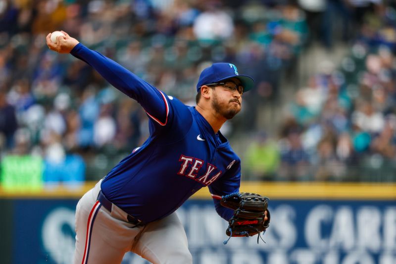 Jun 16, 2024; Seattle, Washington, USA; Texas Rangers starting pitcher Dane Dunning (33) throws against the Seattle Mariners during the first inning at T-Mobile Park. Mandatory Credit: Joe Nicholson-USA TODAY Sports