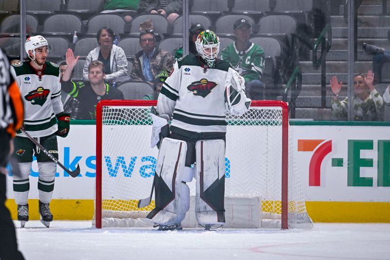 Sep 29, 2022; Dallas, Texas, USA; Minnesota Wild goaltender Jesper Wallstedt (30) celebrates getting the win over the Dallas Stars at the American Airlines Center. Mandatory Credit: Jerome Miron-USA TODAY Sports