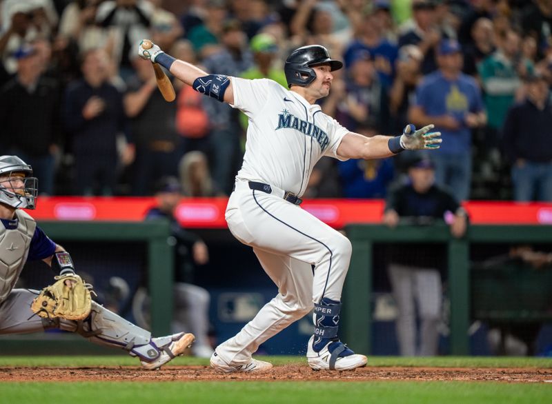 Sep 24, 2025; Seattle, Washington, USA; Seattle Mariners catcher Cal Raleigh (29) hits a solo home run during the eighth inning against the Colorado Rockies at T-Mobile Park. Mandatory Credit: Stephen Brashear-Imagn Images