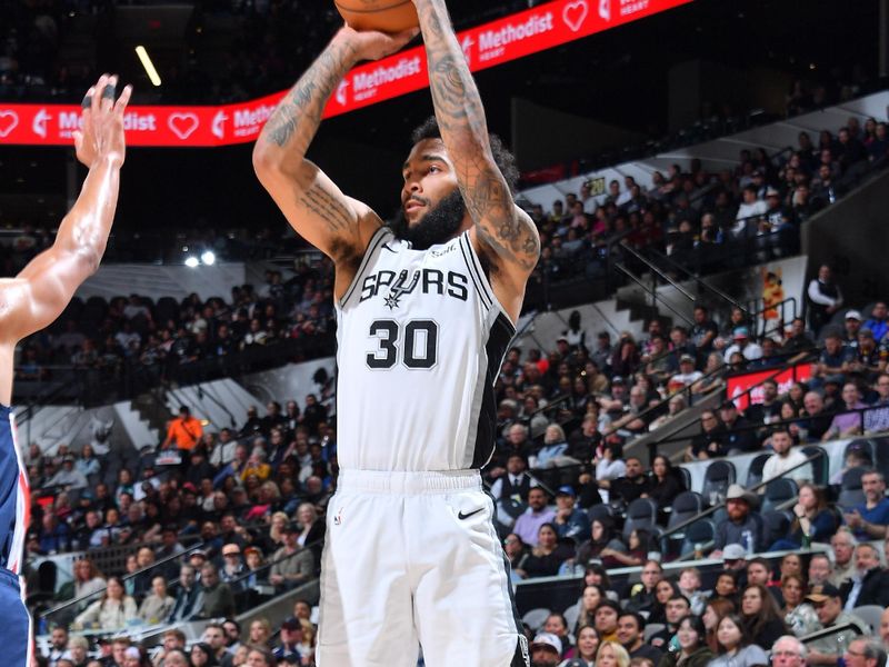 SAN ANTONIO, TX - JANUARY 29:  Julian Champagnie #30 of the San Antonio Spurs shoots the ball during the game  against the Washington Wizards on January 29, 2024 at the Frost Bank Center in San Antonio, Texas. NOTE TO USER: User expressly acknowledges and agrees that, by downloading and or using this photograph, user is consenting to the terms and conditions of the Getty Images License Agreement. Mandatory Copyright Notice: Copyright 2024 NBAE (Photos by Michael Gonzales/NBAE via Getty Images)
