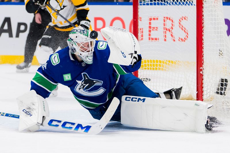 Feb 27, 2024; Vancouver, British Columbia, CAN; Vancouver Canucks goalie Thatcher Demko (35) makes a save in overtime against the Pittsburgh Penguins at Rogers Arena. Penguins won 4-3 in overtime. Mandatory Credit: Bob Frid-USA TODAY Sports