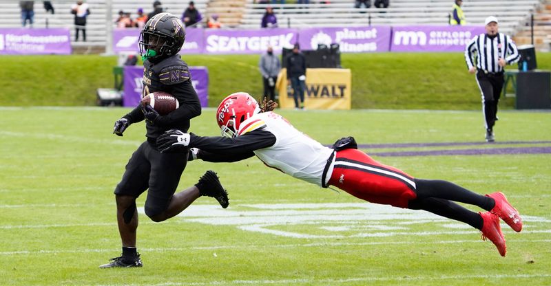 Oct 28, 2023; Evanston, Illinois, USA; Maryland Terrapins defensive back Ja'Quan Sheppard (3) tries to tackle Northwestern Wildcats running back Joseph Himon II (20) during the second half at Ryan Field. Mandatory Credit: David Banks-USA TODAY Sports