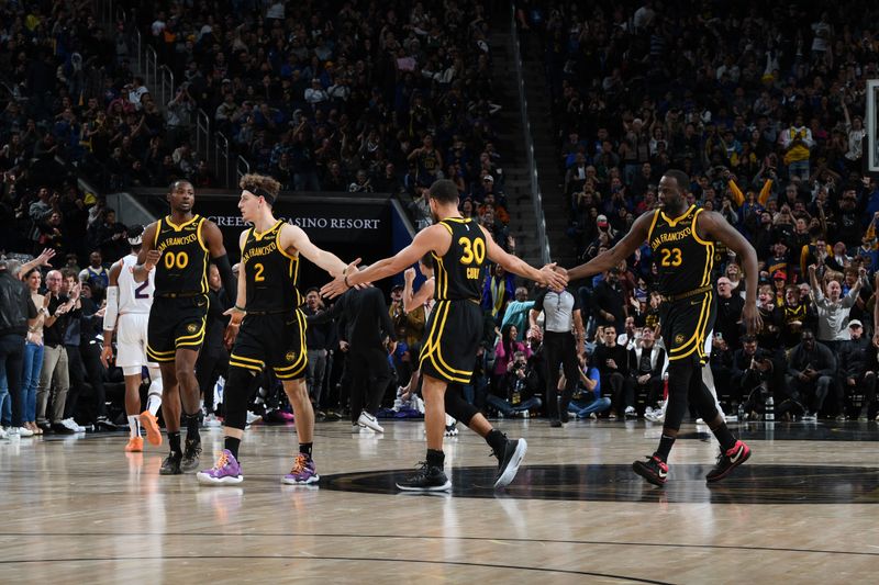 SAN FRANCISCO, CA - FEBRUARY 10: The Golden State Warriors high five during the game against the Phoenix Suns on February 10, 2024 at Chase Center in San Francisco, California. NOTE TO USER: User expressly acknowledges and agrees that, by downloading and or using this photograph, user is consenting to the terms and conditions of Getty Images License Agreement. Mandatory Copyright Notice: Copyright 2024 NBAE (Photo by Noah Graham/NBAE via Getty Images)