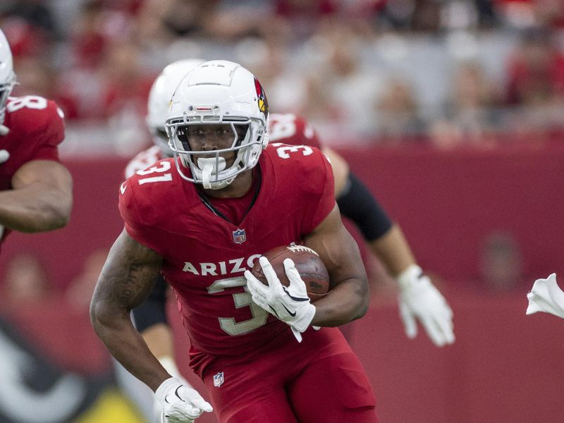 Arizona Cardinals running back Emari Demercado (31) runs the ball against the Los Angeles Rams in an NFL football game, Sunday, Sept. 15, 2024, in Glendale, Ariz. Cardinals defeated the Rams 41-10. (AP Photo/Jeff Lewis)