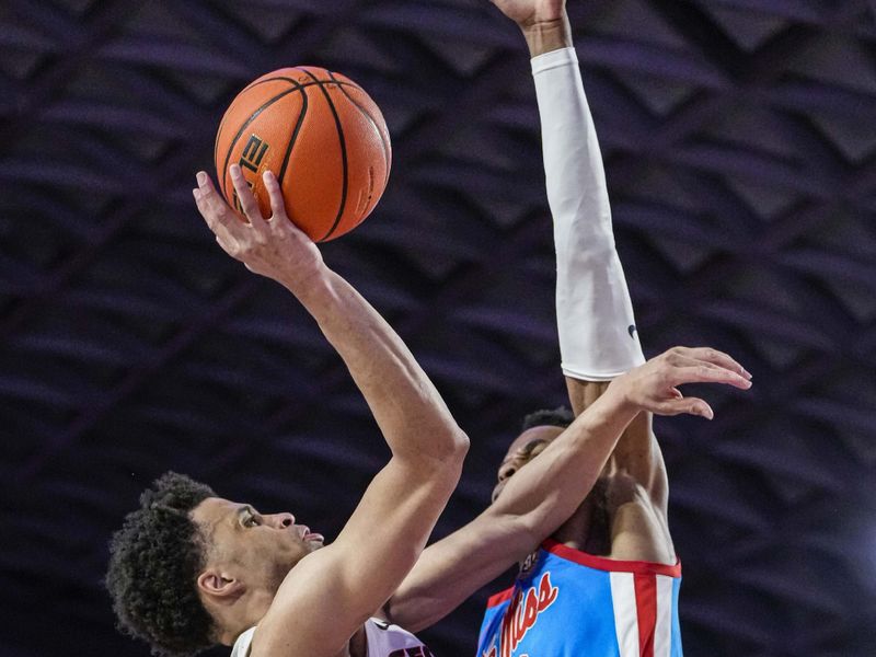 Feb 7, 2023; Athens, Georgia, USA; Georgia Bulldogs guard Jabri Abdur-Rahim (1) tries to shoot defended by Mississippi Rebels forward Theo Akwuba (10) during the second half at Stegeman Coliseum. Mandatory Credit: Dale Zanine-USA TODAY Sports