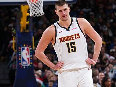 DENVER, CO - DECEMBER 25: Nikola Jokic #15 of the Denver Nuggets looks on during the game against the Golden State Warriors on December 25, 2023 at the Ball Arena in Denver, Colorado. NOTE TO USER: User expressly acknowledges and agrees that, by downloading and/or using this Photograph, user is consenting to the terms and conditions of the Getty Images License Agreement. Mandatory Copyright Notice: Copyright 2023 NBAE (Photo by Garrett Ellwood/NBAE via Getty Images)