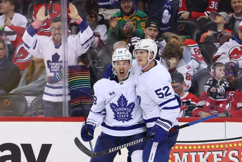 Mar 7, 2023; Newark, New Jersey, USA; Toronto Maple Leafs left wing Michael Bunting (58) celebrates his goal against the New Jersey Devils during the third period at Prudential Center. Mandatory Credit: Ed Mulholland-USA TODAY Sports