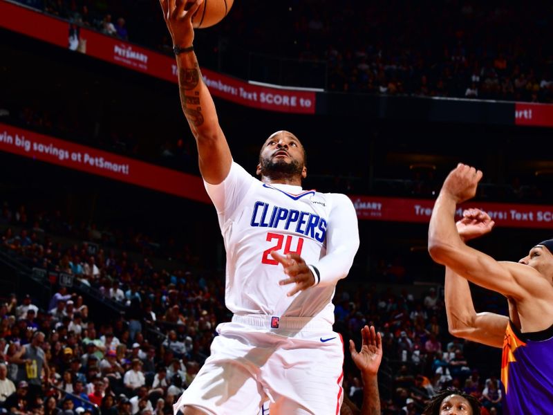 PHOENIX, AZ - APRIL 9: Norman Powell #24 of the LA Clippers shoots the ball during the game against the Phoenix Suns on April 9, 2023 at Footprint Center in Phoenix, Arizona. NOTE TO USER: User expressly acknowledges and agrees that, by downloading and or using this photograph, user is consenting to the terms and conditions of the Getty Images License Agreement. Mandatory Copyright Notice: Copyright 2023 NBAE (Photo by Barry Gossage/NBAE via Getty Images)