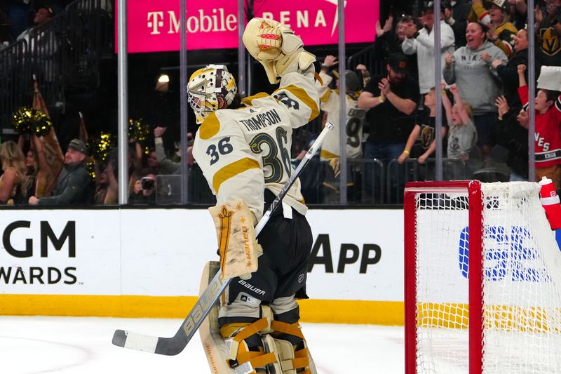 Mar 21, 2024; Las Vegas, Nevada, USA; Vegas Golden Knights goaltender Logan Thompson (36) celebrates after the Golden Knights defeated the Seattle Kraken 3-1 at T-Mobile Arena. Mandatory Credit: Stephen R. Sylvanie-USA TODAY Sports