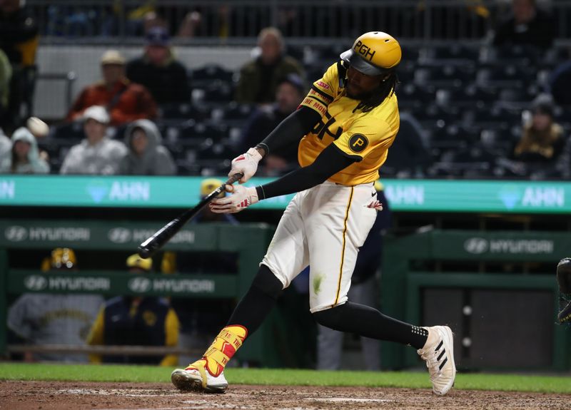 May 23, 2025; Pittsburgh, Pennsylvania, USA;  Pittsburgh Pirates center fielder Oneil Cruz (15) hits his second solo home run of the game against the Milwaukee Brewers during the ninth inning at PNC Park. Mandatory Credit: Charles LeClaire-Imagn Images