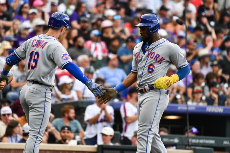 May 28, 2023; Denver, Colorado, USA;  New York Mets center fielder Starling Marte (6) is congratulated by New York Mets right fielder Mark Canha (19) after scoring in the fifth inning against the Colorado Rockies at Coors Field. Mandatory Credit: John Leyba-USA TODAY Sports