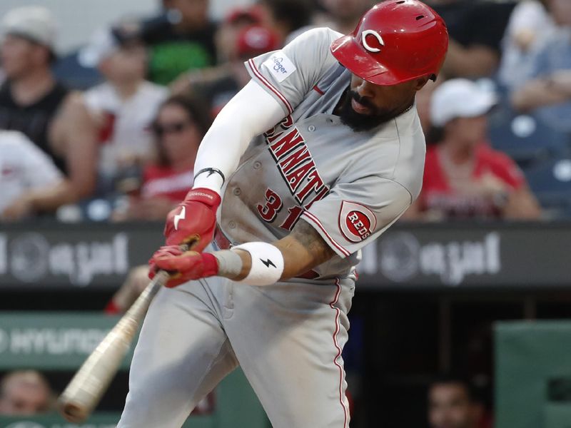 Aug 13, 2023; Pittsburgh, PA, USA; Cincinnati Reds right fielder Henry Ramos (31) hits a single against the Pittsburgh Pirates during the sixth inning at PNC Park. Mandatory Credit: Charles LeClaire-USA TODAY Sports