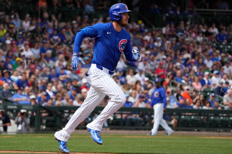 Mar 6, 2024; Mesa, Arizona, USA; Chicago Cubs center fielder Cody Bellinger (24) hits against the Los Angeles Angels in the first inning at Sloan Park. Mandatory Credit: Rick Scuteri-USA TODAY Sports