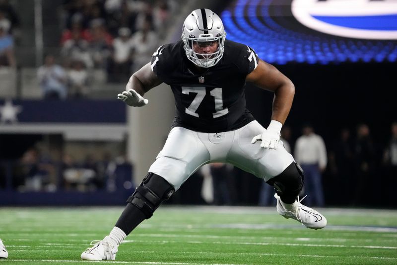 Las Vegas Raiders offensive tackle Justin Herron prepares to block during the first half of a preseason NFL football game against the Dallas Cowboys in Arlington, Texas, Saturday, Aug. 26, 2023. (AP Photo/Sam Hodde)