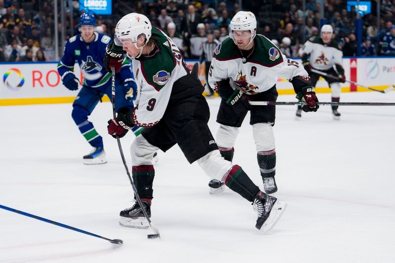 Jan 18, 2024; Vancouver, British Columbia, CAN; Arizona Coyotes forward Clayton Keller (9) shoots against the Arizona Coyotes in the second period at Rogers Arena. Mandatory Credit: Bob Frid-USA TODAY Sports
