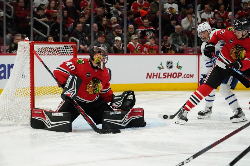 Nov 24, 2023; Chicago, Illinois, USA; Toronto Maple Leafs center Calle Jarnkrok (19) scores a goal on Chicago Blackhawks goaltender Arvid Soderblom (40) during the second period at United Center. Mandatory Credit: David Banks-USA TODAY Sports