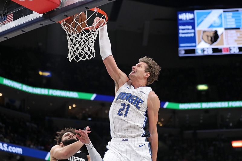 MEMPHIS, TENNESSEE - JANUARY 26: Moritz Wagner #21 of the Orlando Magic dunks during the first half against the Memphis Grizzlies at FedExForum on January 26, 2024 in Memphis, Tennessee. NOTE TO USER: User expressly acknowledges and agrees that, by downloading and or using this photograph, User is consenting to the terms and conditions of the Getty Images License Agreement. (Photo by Justin Ford/Getty Images)