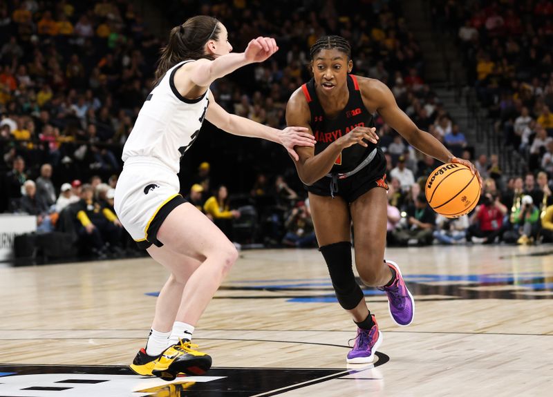 Mar 4, 2023; Minneapolis, MINN, USA; Maryland Terrapins guard Diamond Miller (1) dribbles while Iowa Hawkeyes guard Caitlin Clark (22) defends during the second half at Target Center. Mandatory Credit: Matt Krohn-USA TODAY Sports