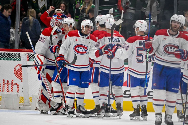 Jan 2, 2024; Dallas, Texas, USA; The Montreal Canadiens celebrate on the ice after the Canadiens defeat the Dallas Stars at the American Airlines Center. Mandatory Credit: Jerome Miron-USA TODAY Sports