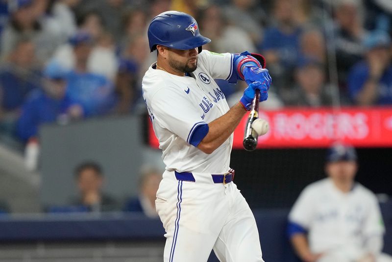 Jun 2, 2024; Toronto, Ontario, CAN; Toronto Blue Jays second baseman Isiah Kiner-Falefa (7) makes contact with a ball against the Pittsburgh Pirates during the sixth inning at Rogers Centre. Mandatory Credit: John E. Sokolowski-USA TODAY Sports