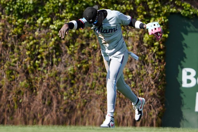 Apr 21, 2024; Chicago, Illinois, USA; Miami Marlins outfielder Jazz Chisholm Jr. (2) celebrates the win against the Chicago Cubs at Wrigley Field. Mandatory Credit: David Banks-USA TODAY Sports