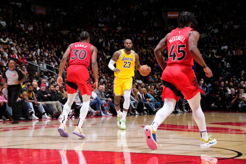 TORONTO, CANADA - NOVEMBER 1: LeBron James #23 of the Los Angeles Lakers dribbles the ball during the game against the Toronto Raptors on November 1, 2024 at the Scotiabank Arena in Toronto, Ontario, Canada.  NOTE TO USER: User expressly acknowledges and agrees that, by downloading and or using this Photograph, user is consenting to the terms and conditions of the Getty Images License Agreement.  Mandatory Copyright Notice: Copyright 2024 NBAE (Photo by Mark Blinch/NBAE via Getty Images)