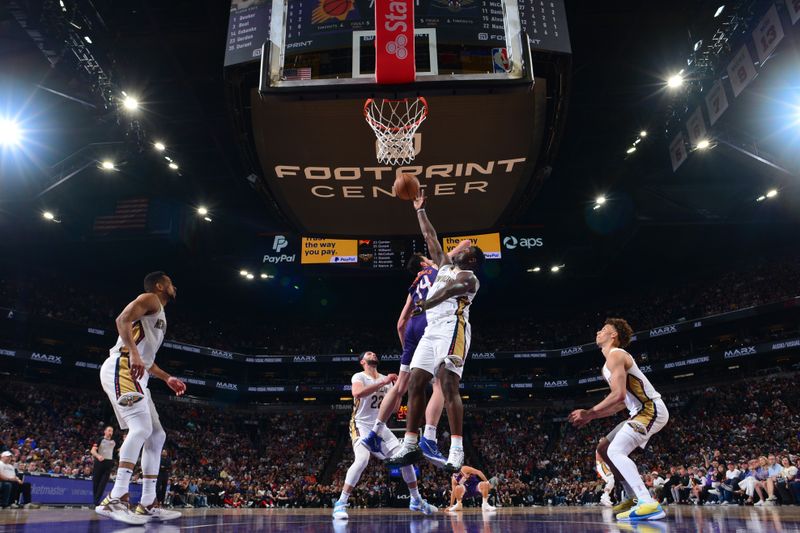 PHOENIX, AZ - APRIL 7: Zion Williamson #1 of the New Orleans Pelicans goes up for the rebound during the game against the Phoenix Suns on April 7, 2024 at Footprint Center in Phoenix, Arizona. NOTE TO USER: User expressly acknowledges and agrees that, by downloading and or using this photograph, user is consenting to the terms and conditions of the Getty Images License Agreement. Mandatory Copyright Notice: Copyright 2024 NBAE (Photo by Kate Frese/NBAE via Getty Images)